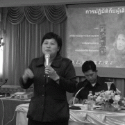A woman giving a training to police