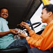 A practitioner talking to a truck drive in Bangladesh