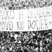 Banner held by protesters in Brazil