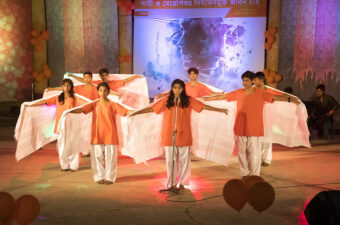 A musical performance on stage in Bangladesh.