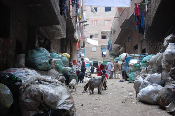 People sorting through trash in "Garbage City", Cairo, Egypt, in order to find recyclable products.