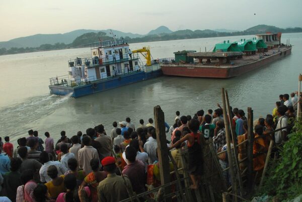 Activists of the KMSS farmers' rights movement block turbines for the Lower Subansiri Dam from being unloaded