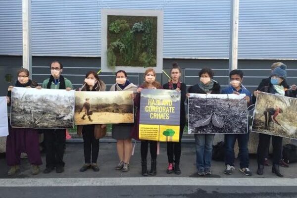 Group protesting corporate impact on climate at COP 21