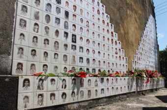 A memorial wall with the faces of disappeared family members in Sri Lanka