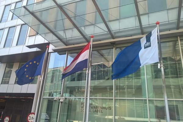 Photo of the Dutch and EU flags at the Hague