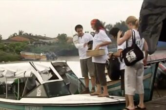 Volunteers in Colombia getting onto a boat