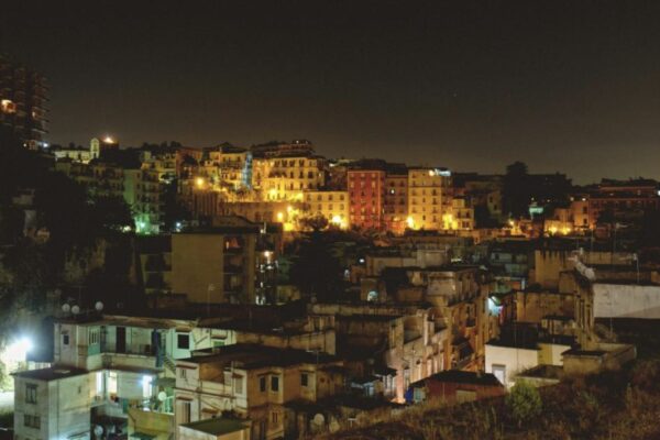 Dark buildings on a hillside