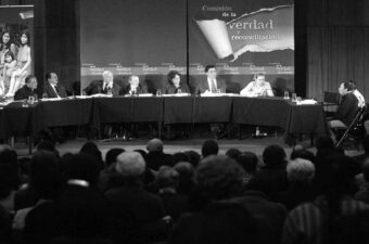 Group of commission members listens to a witness during the Public Audience that took place in Ayacucho