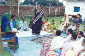 Woman leader conducting community mediating process