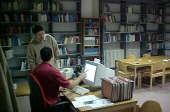 Staff at the Human Rights Centre gathered around a computer