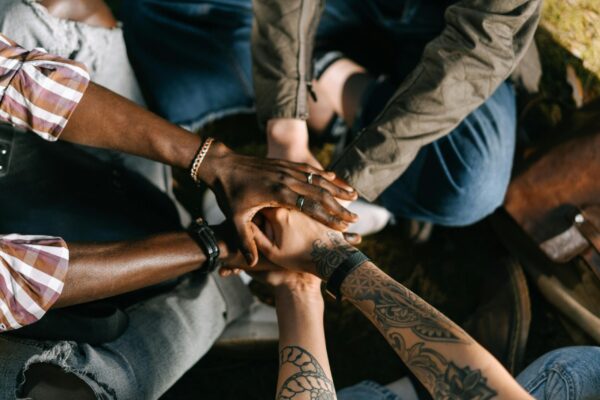 People with their hands together