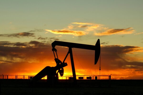 Oil extraction equipment with a sunset in the distance