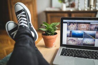 Feet up on a desk, with the flickr website open on the computer