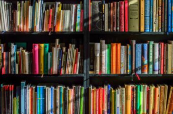 Books on a shelf at a library.